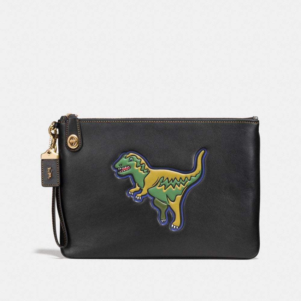 COACH Dinosaur Turnlock Wristlet 30 in Glovetanned Leather