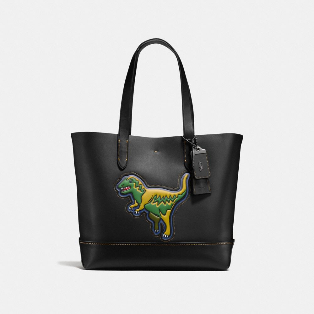coach backpack with dinosaur Reversible City Tote in Signature Canvas Motif Tote With Camo Print And