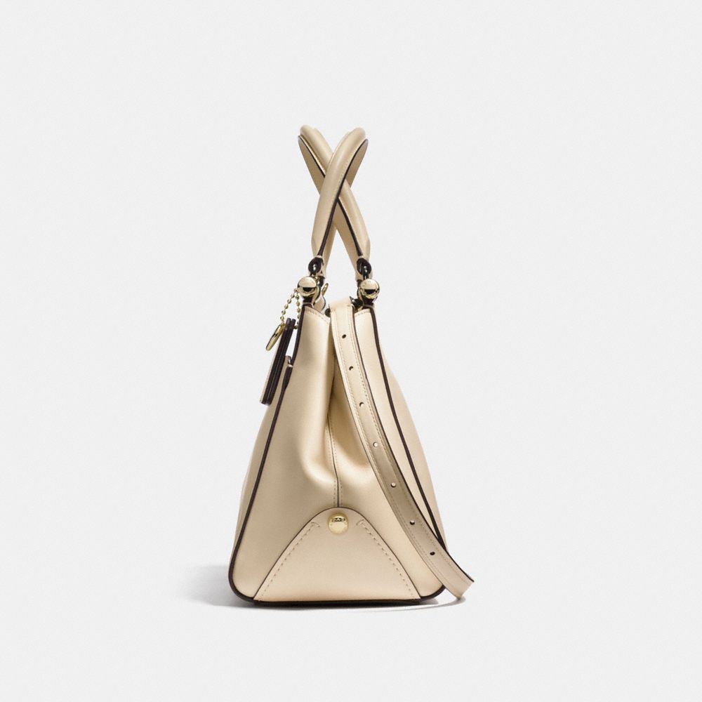 white and gold coach purse