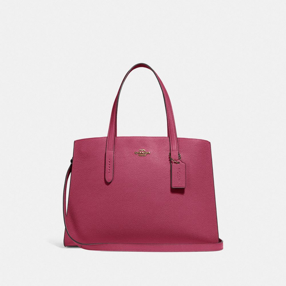 coach charlie carryall pink