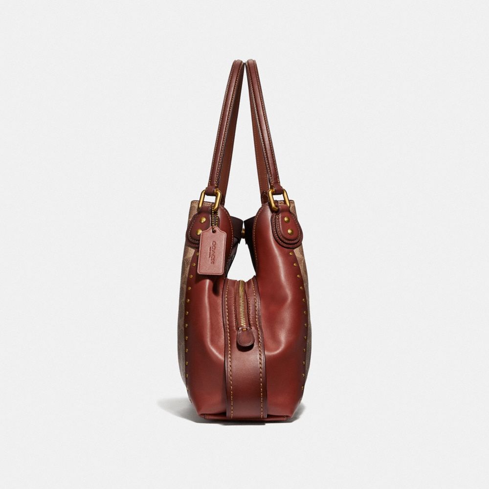 edie shoulder bag 31 in signature canvas with rivets