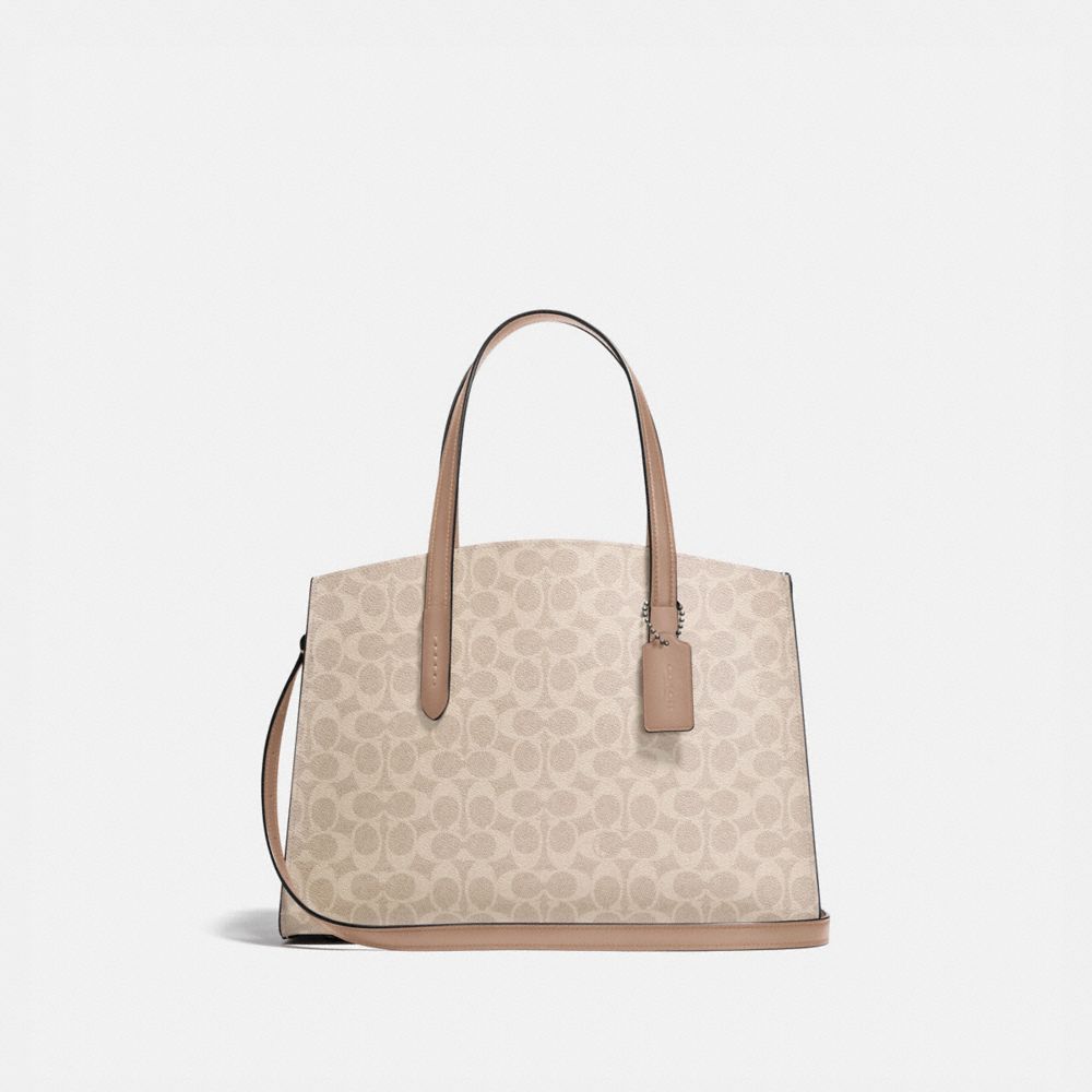 coach charlie carryall in signature canvas