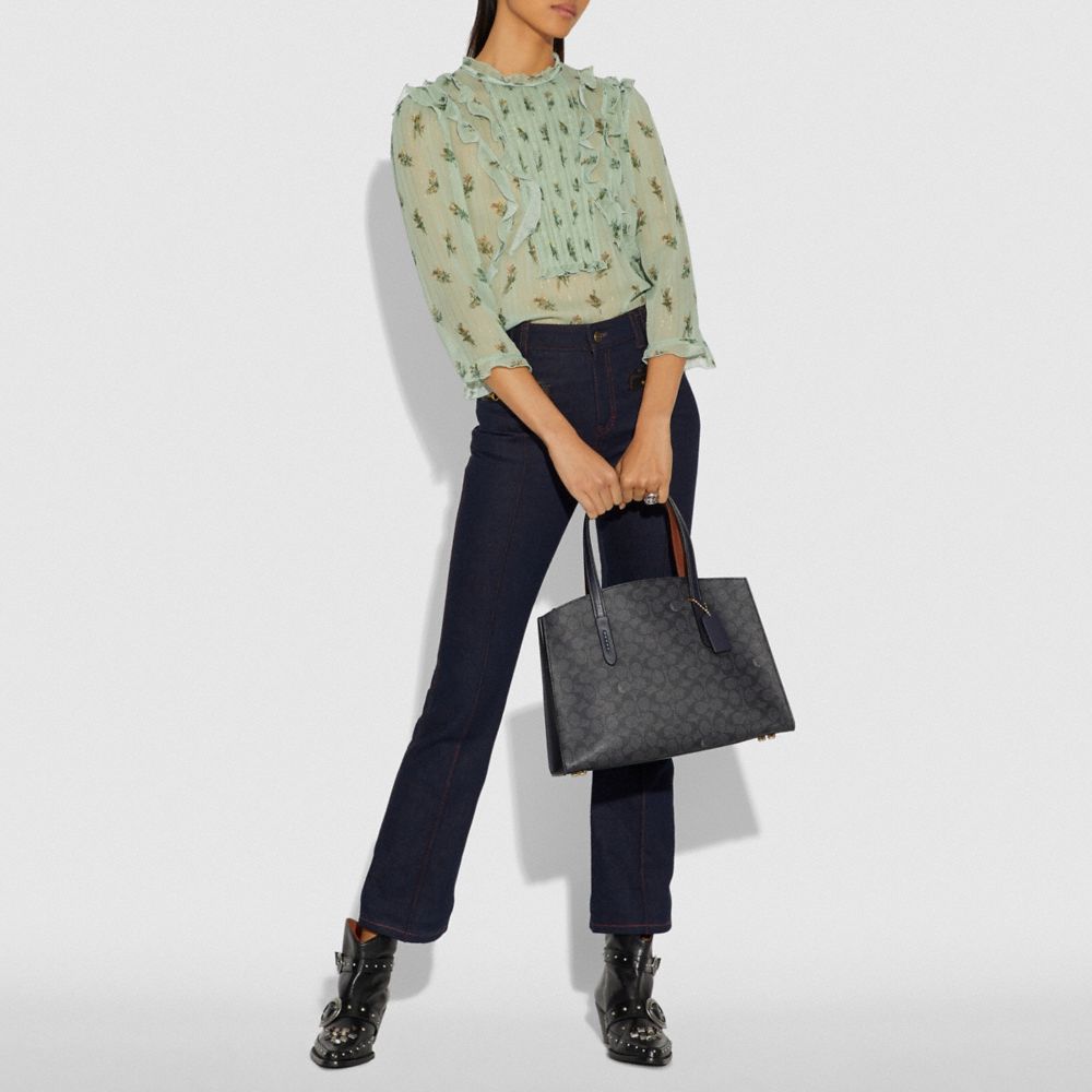 coach charlie carryall in signature canvas