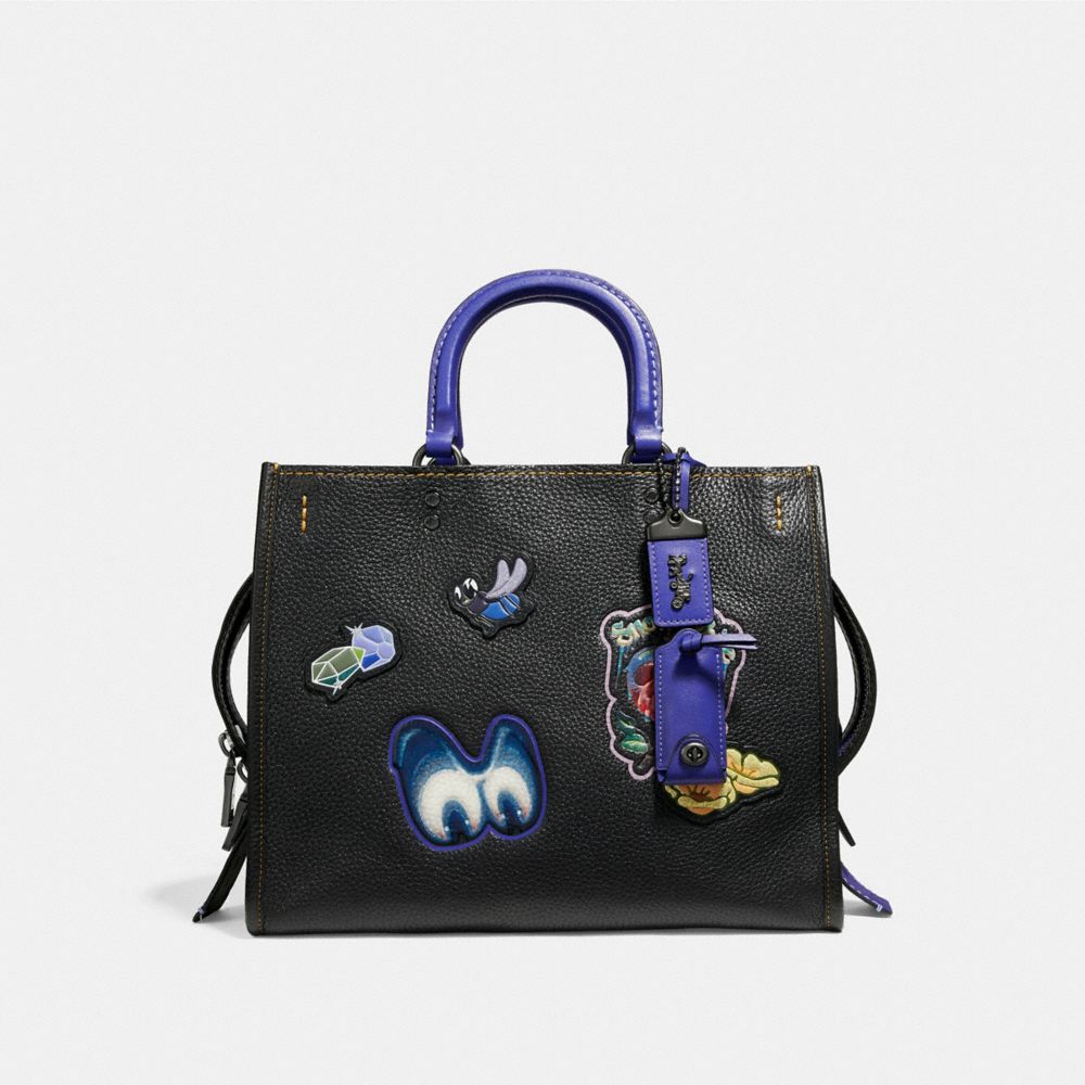 DISNEY X COACH ROGUE WITH PATCHES
