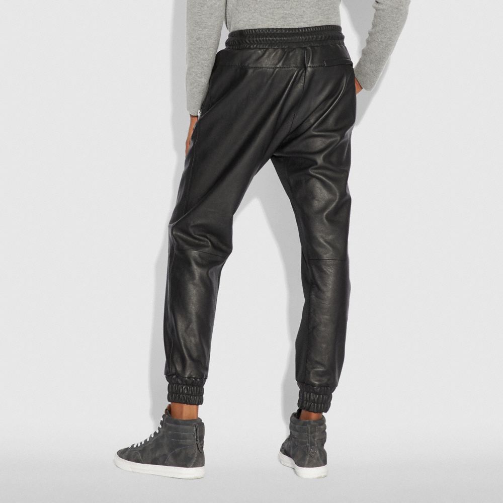 black leather track pants