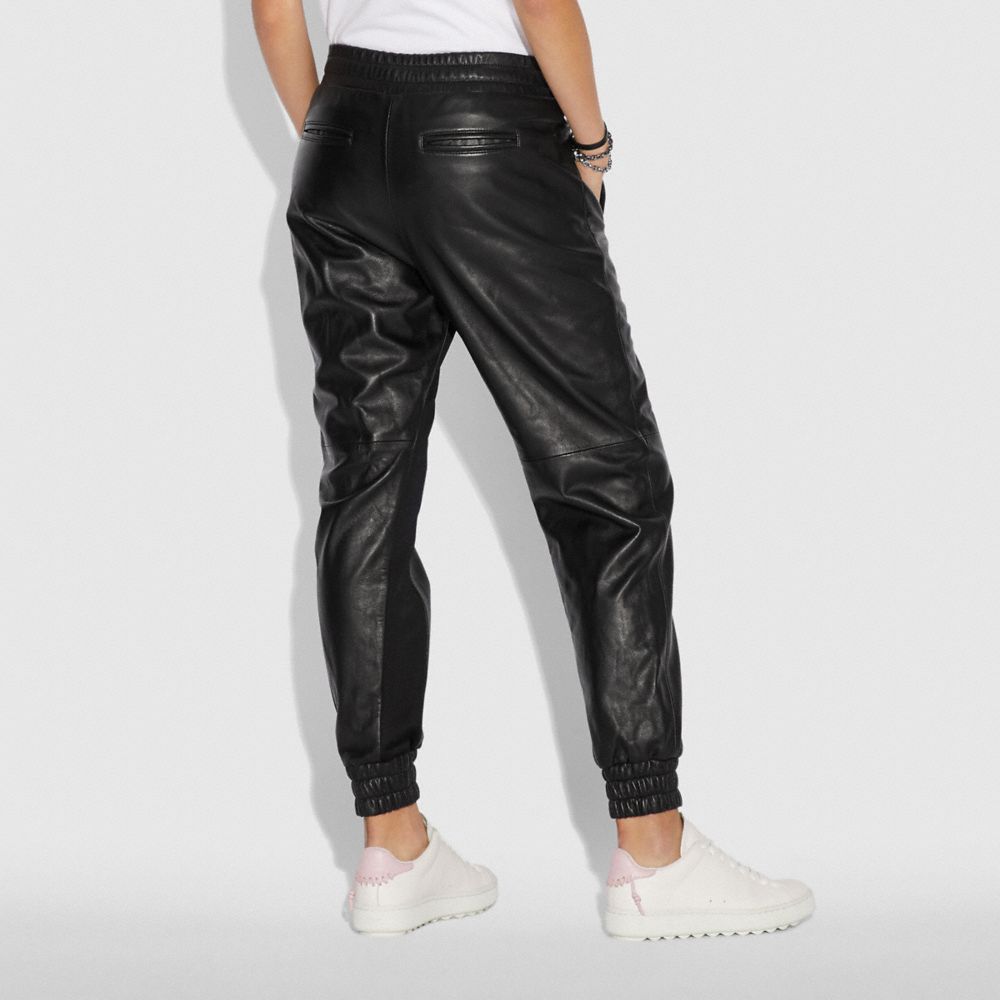 black leather track pants