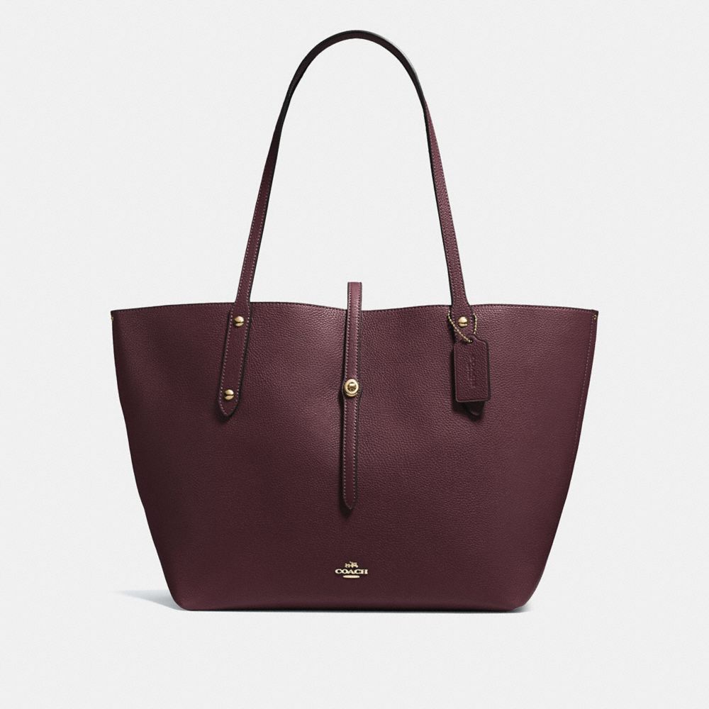 oxblood coach purse