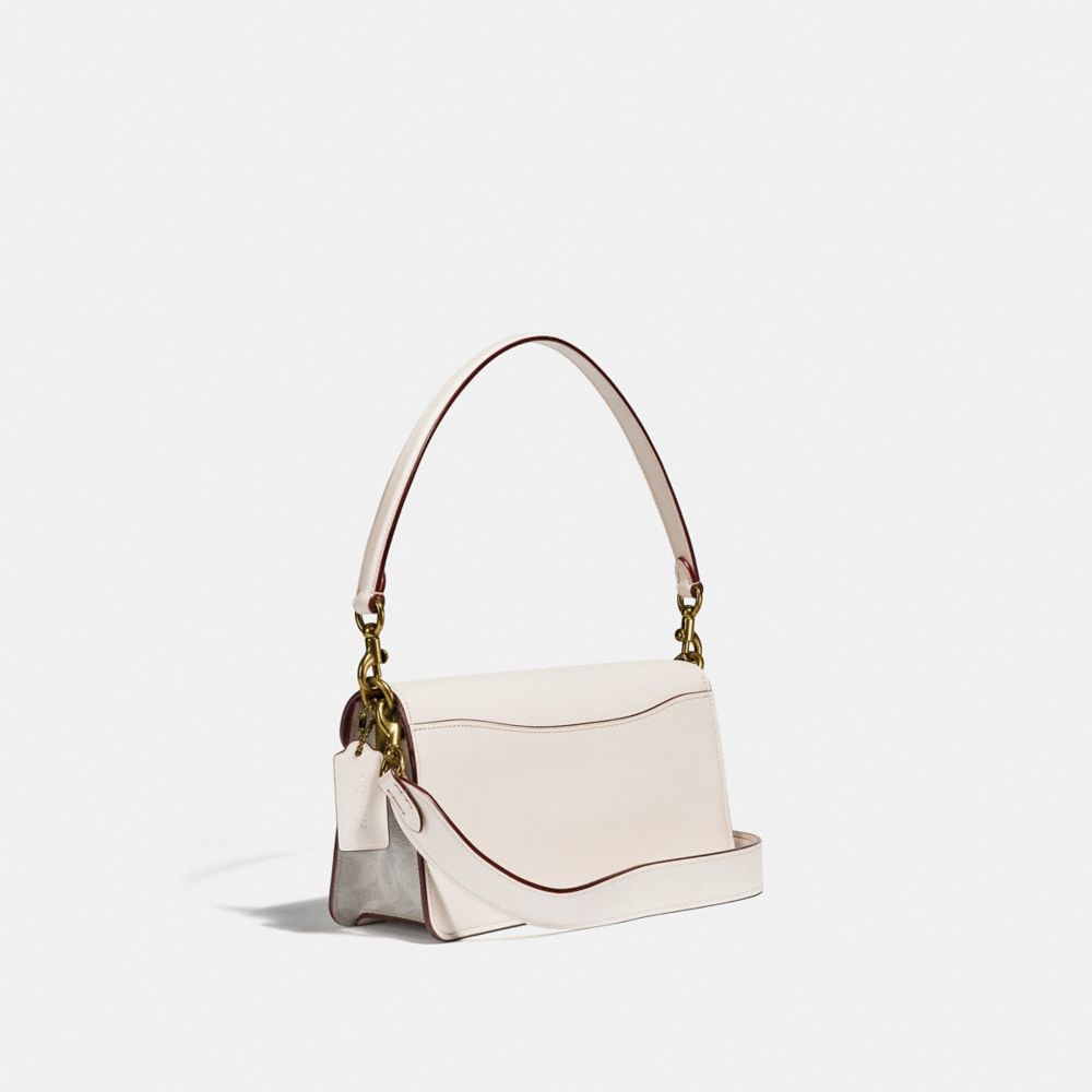 white coach purse with flowers