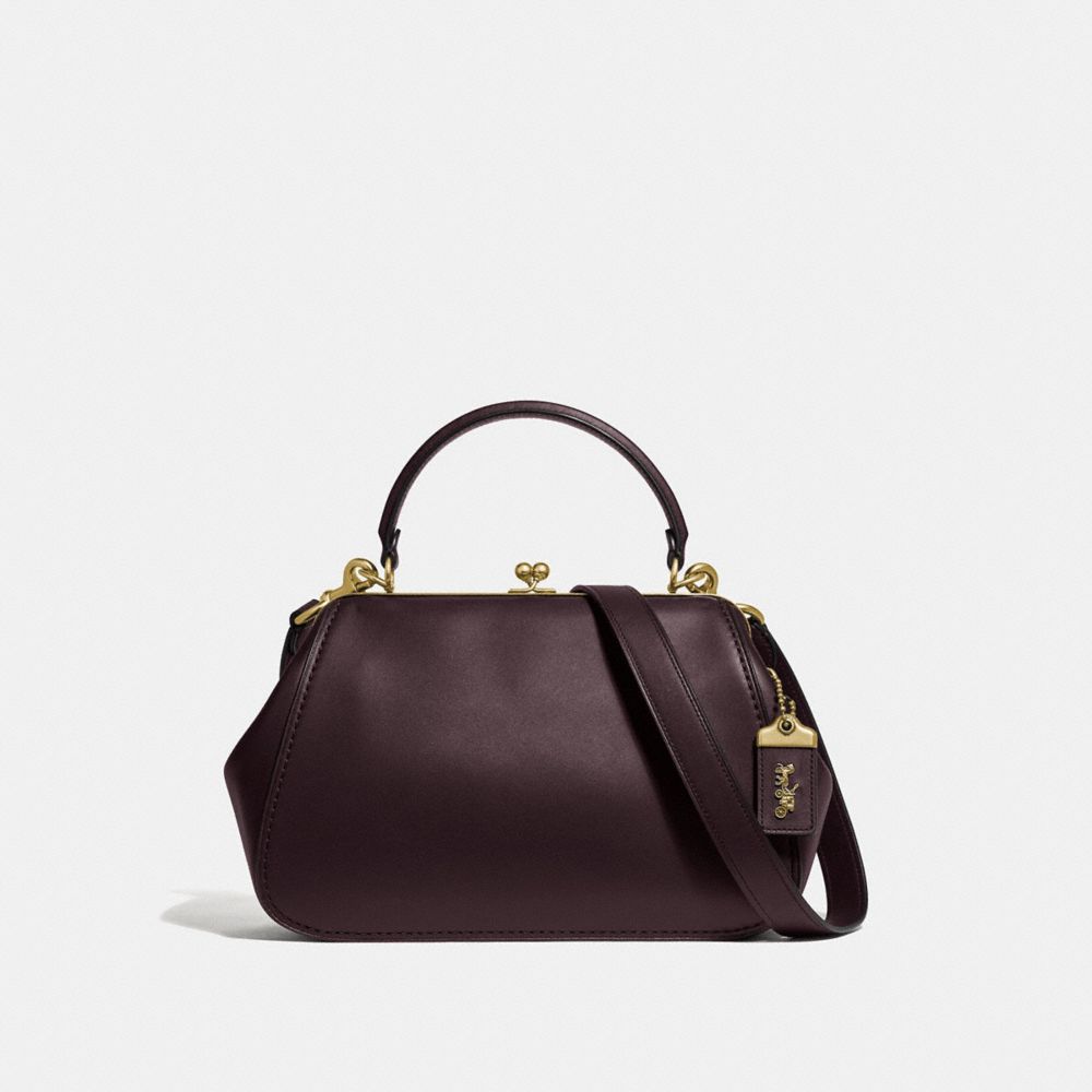 oxblood coach purse