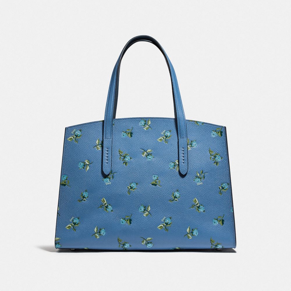 blue coach bag with flowers