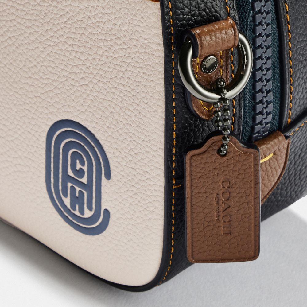 coach camera bag signature