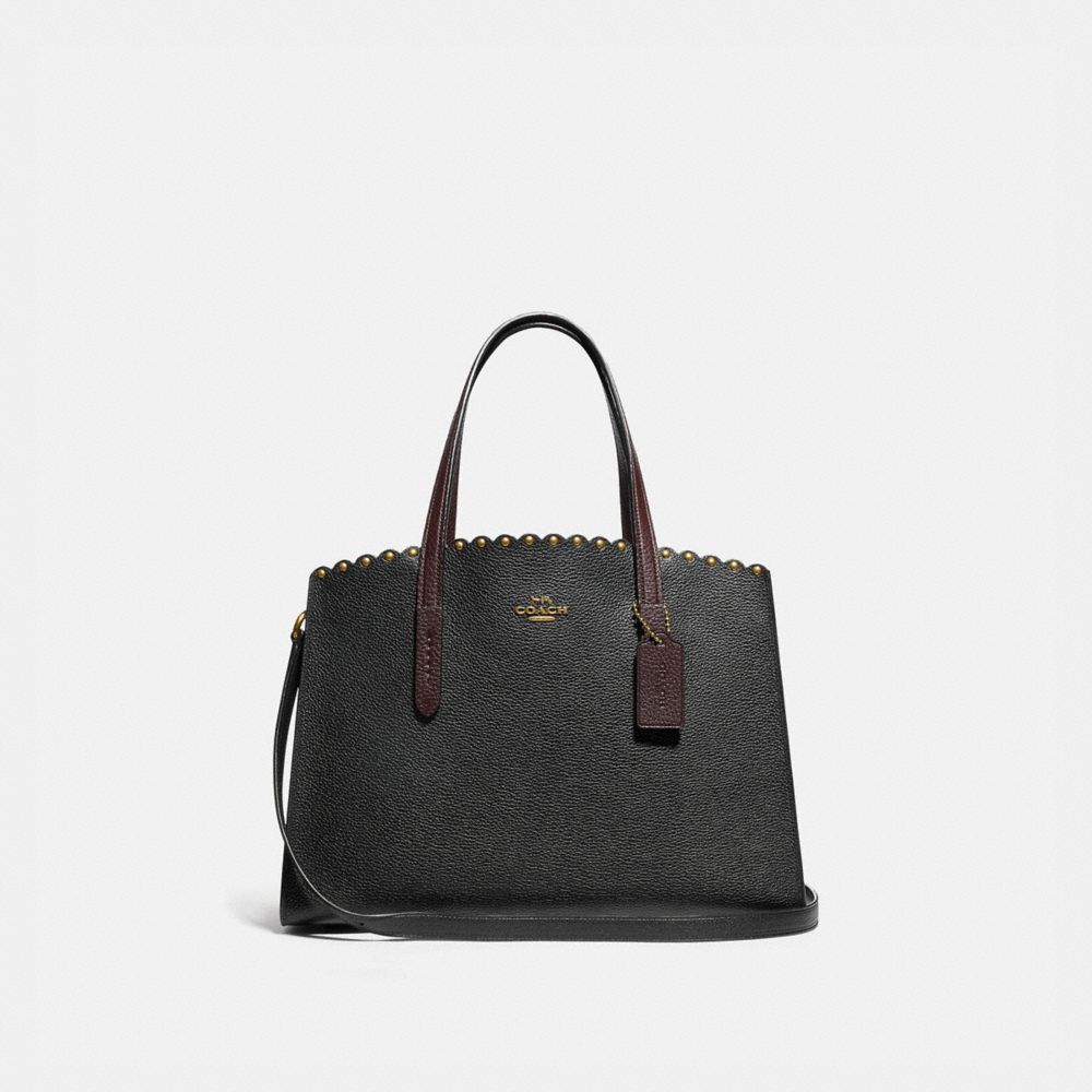 coach charlie carryall with rivets