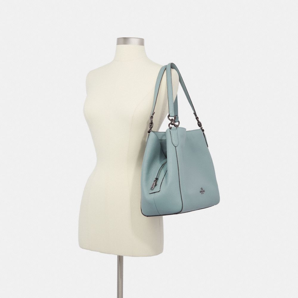 teal coach bag