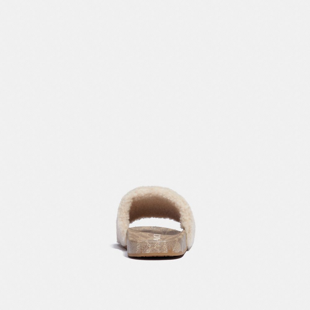 coach shearling slides