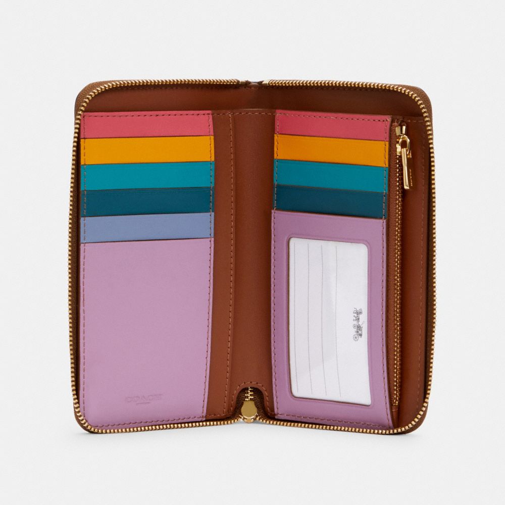 MEDIUM ZIP AROUND WALLET IN SIGNATURE CANVAS WITH COLORBLOCK INTERIOR - Alternate View 1