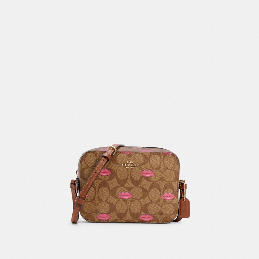 MINI CAMERA BAG IN SIGNATURE CANVAS WITH LIPS PRINT