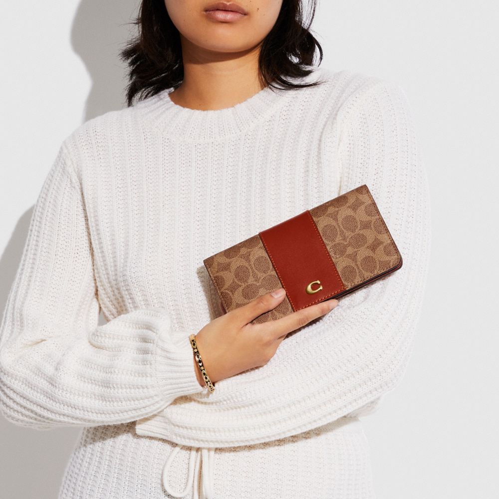 coach slim wallet in signature canvas
