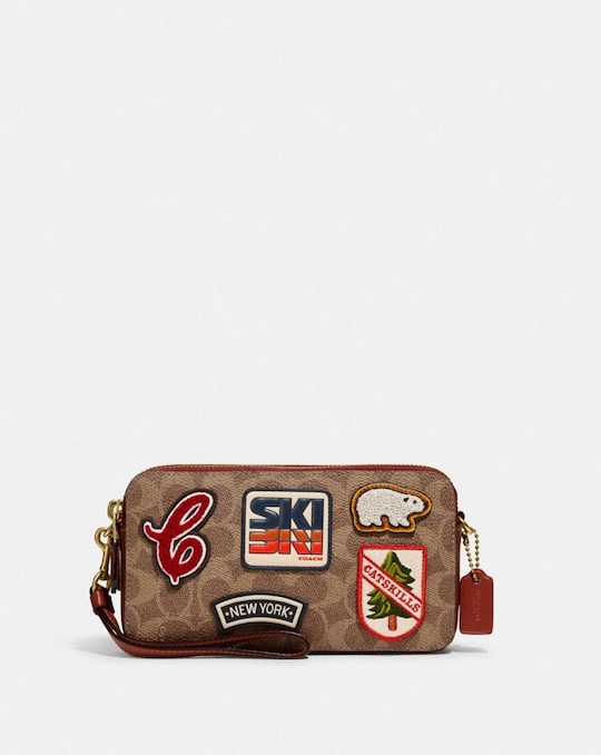 KIRA CROSSBODY IN SIGNATURE CANVAS WITH PATCHES