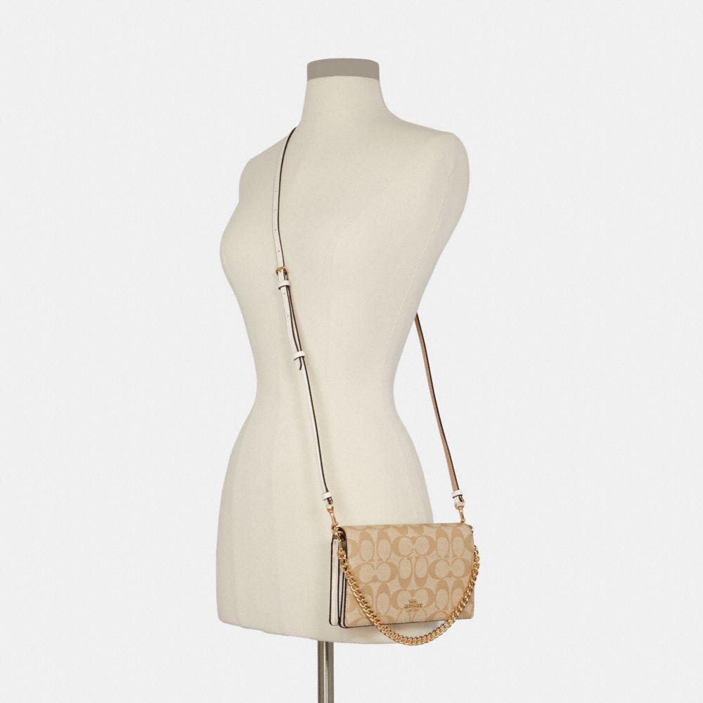 COACH Pochette à bandoulière avec rabat et chaîne Anna en toile exclusive