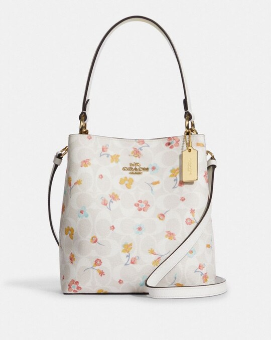 SMALL TOWN BUCKET BAG IN SIGNATURE CANVAS WITH MYSTICAL FLORAL PRINT