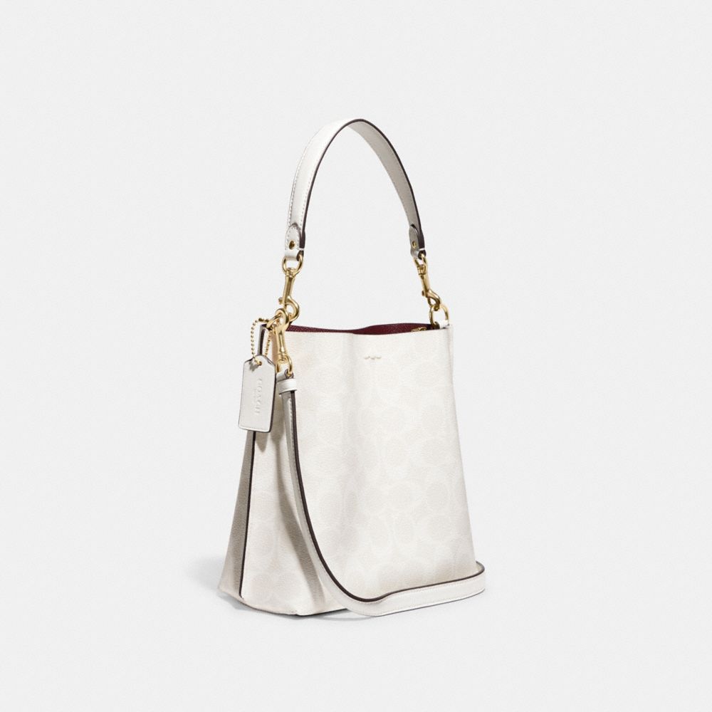 COACH®,QA_AUTO_SIT MOLLIE BUCKET BAG 22 IN SIGNATURE CANVAS ,,Angle View