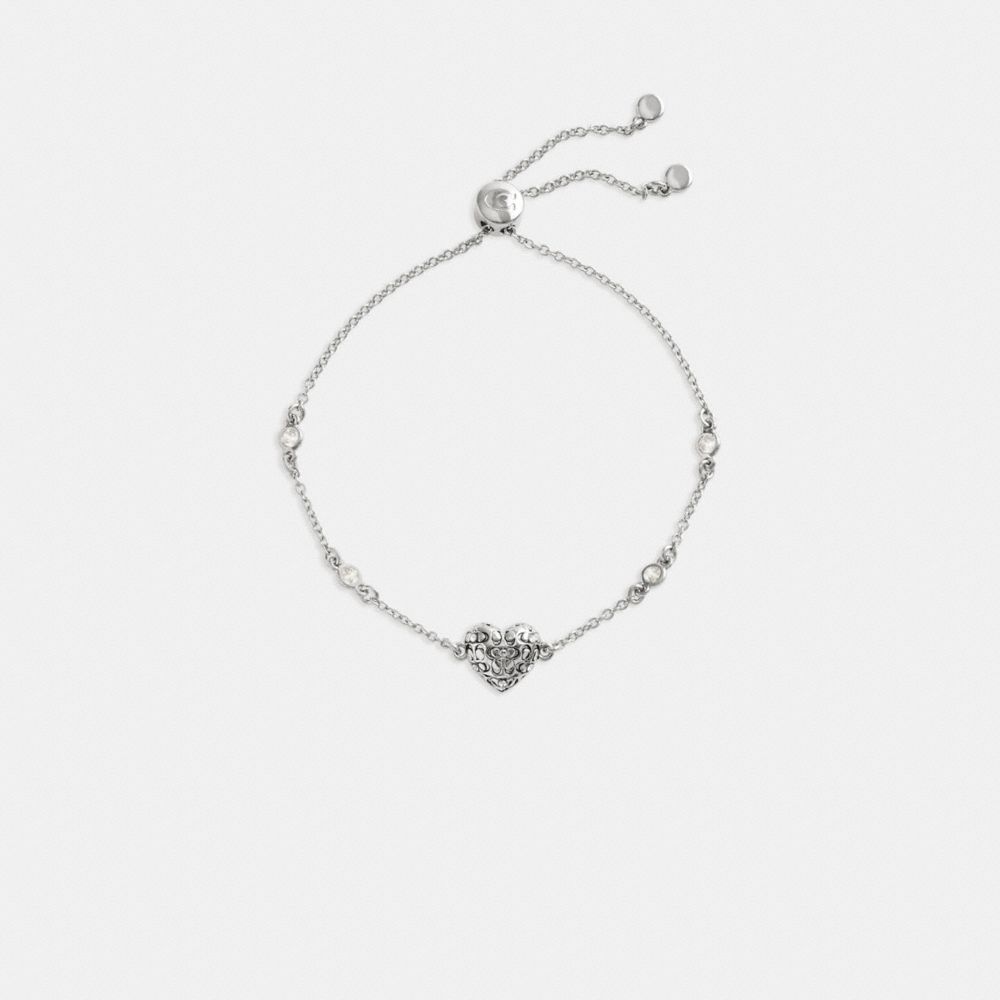 COACH®,Quilted Signature Heart Slider Bracelet,Crystal,Cubic Zirconia,Glass,Circle,Disc,Gem Embellishment,Logo,Brass,Day P...,Clear,Inside View,Top View