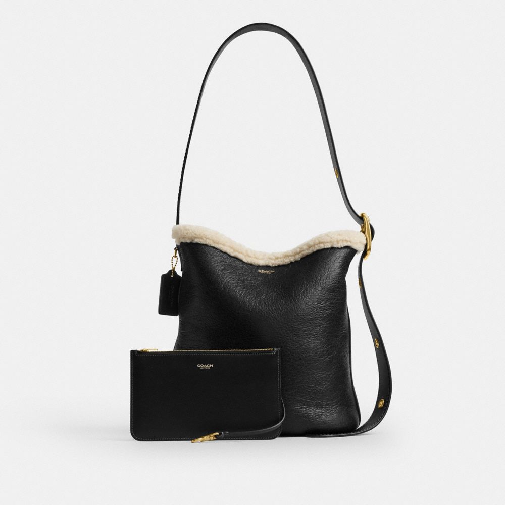 COACH®,Bleecker Bucket Bag In Shearling,Leather,Sheepskin,Shearling,Bucket,Color Block,Shearling,Removable Pouch,Adjustabl...,Black,Angle View