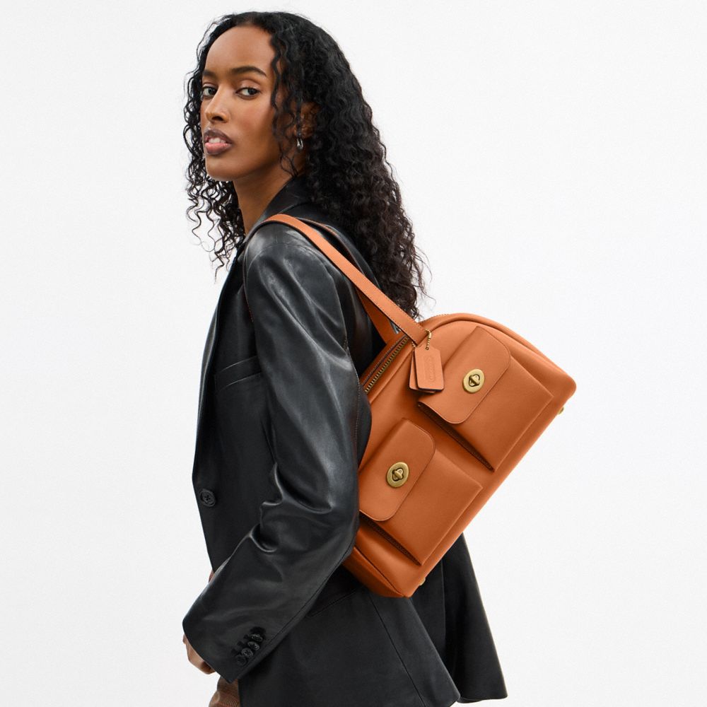 COACH®,Twin Turnlock Bag,Leather,Barrel Bag,Lined,Luggage Tag,Brass,Day Party,Brown,Detail View