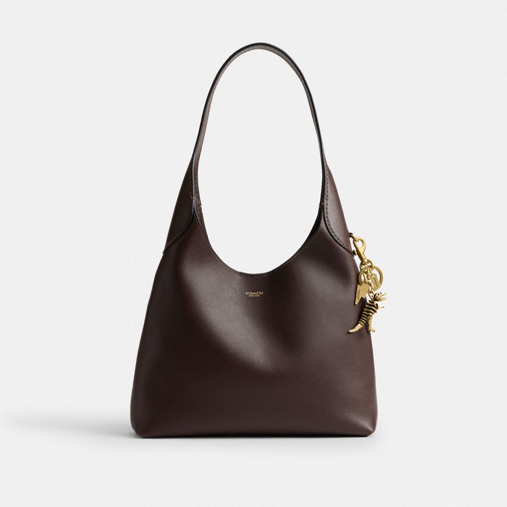 COACH®,Small Rexy Skeleton Bag Charm,Bag Charm,Metal Material,3D Embellishment,Metal,Key Ring,Brass,Gold,Angle View