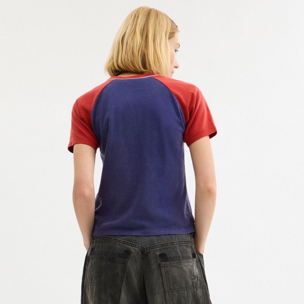COACH®,Lipstick Graphic Raglan T-Shirt In Organic Cotton,Organic Cotton,Cotton,Cotton Knit,T Shirt,Piping,Color Block,Casual,Navy,Scale View