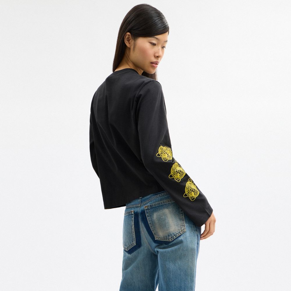 COACH®,Long Sleeve Graphic T-Shirt In Organic Cotton,Organic Cotton,Cotton,T Shirt,Sustainable,Casual,Black,Scale View
