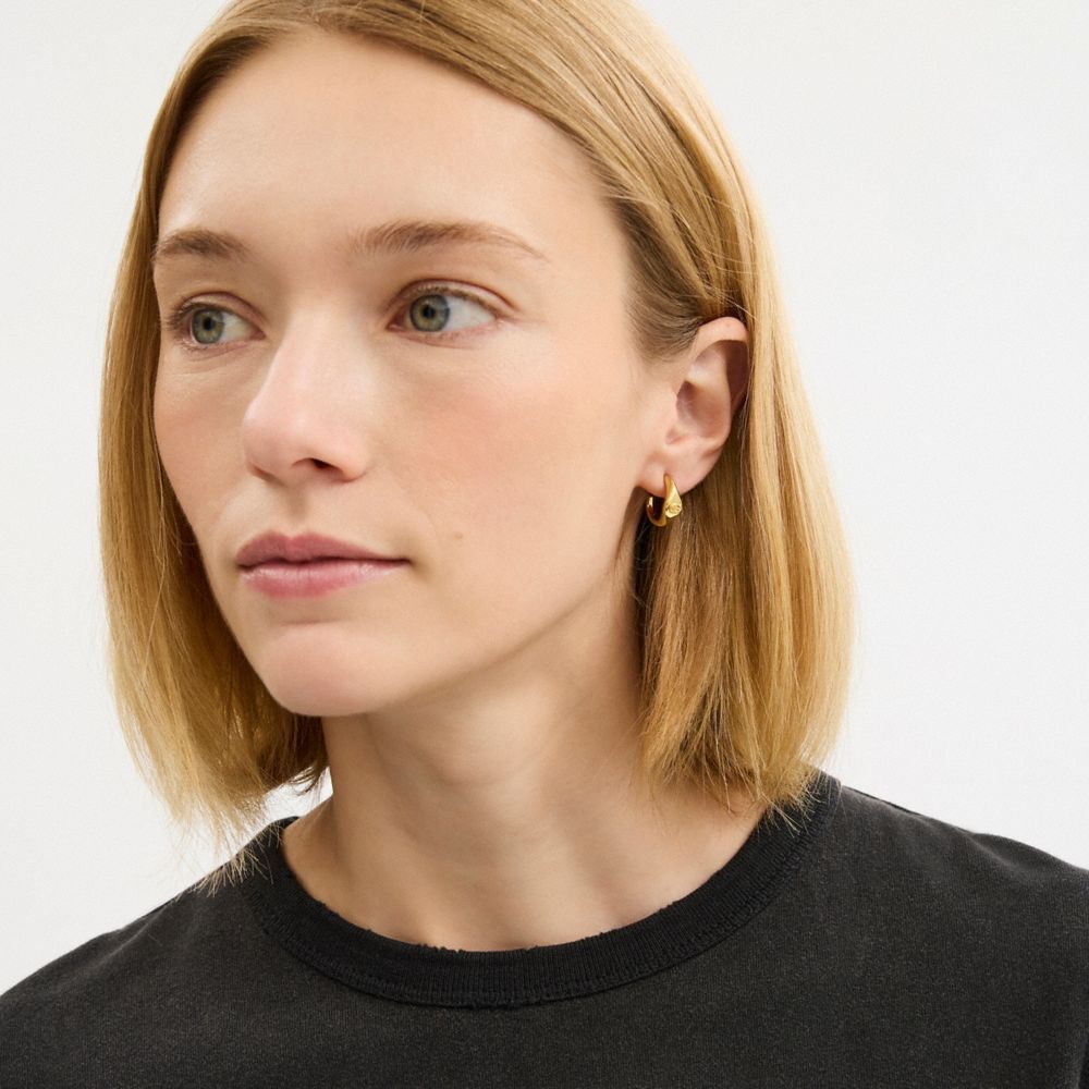 COACH®,Signet Signature Huggie Earrings,Huggies,Hoops,Cubic Zirconia,Lettering Word,Stones,Etchings,Engraving,Logo,Initial...,,Detail View