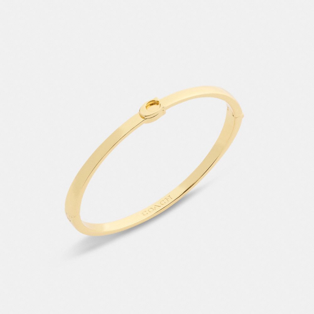 COACH®,Thin Signature Hinged Bangle,Cubic Zirconia,Initials Embellishment,Logo,Lettering Word,Yellow Gold Plated,Brass,Wor...,,Inside View,Top View