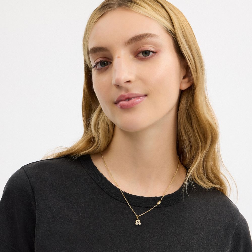 COACH®,Pavé Cherry Pendant Necklace,Single Strand,Glass,Cubic Zirconia,3D Embellishment,Logo,Novelty Embellishment,Letteri...,Gold,Detail View