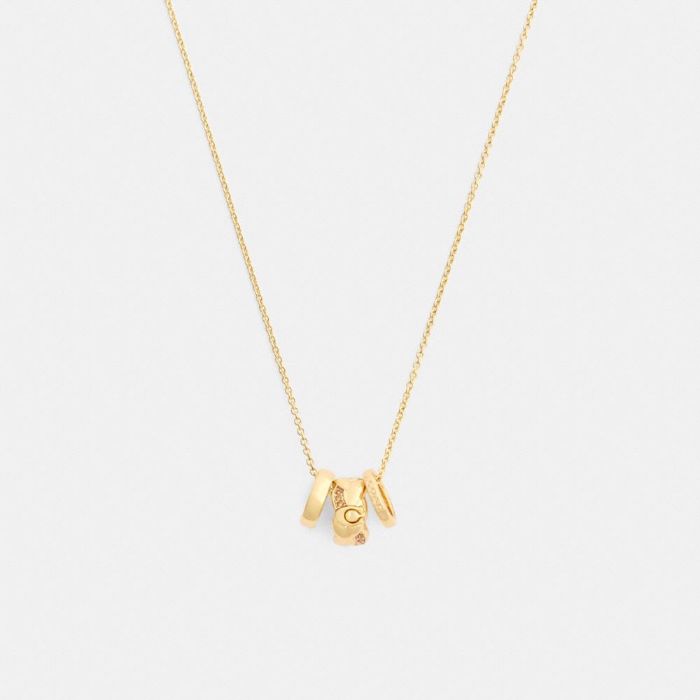 COACH®,Braided Signature Rondell Pendant Necklace,Single Strand,Glass,Cubic Zirconia,Logo,Gem Embellishment,Brass Gold,Casual,White,Front View