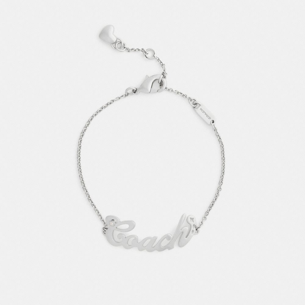 COACH®,Coach Script Nameplate Bracelet,Cubic Zirconia,Logo,Gem Embellishment,Bar Embellishment,Heart Embellishment,Letteri...,Clear,Inside View,Top View