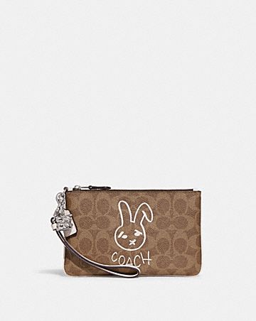lunar new year small wristlet in colorblock signature canvas with rabbit