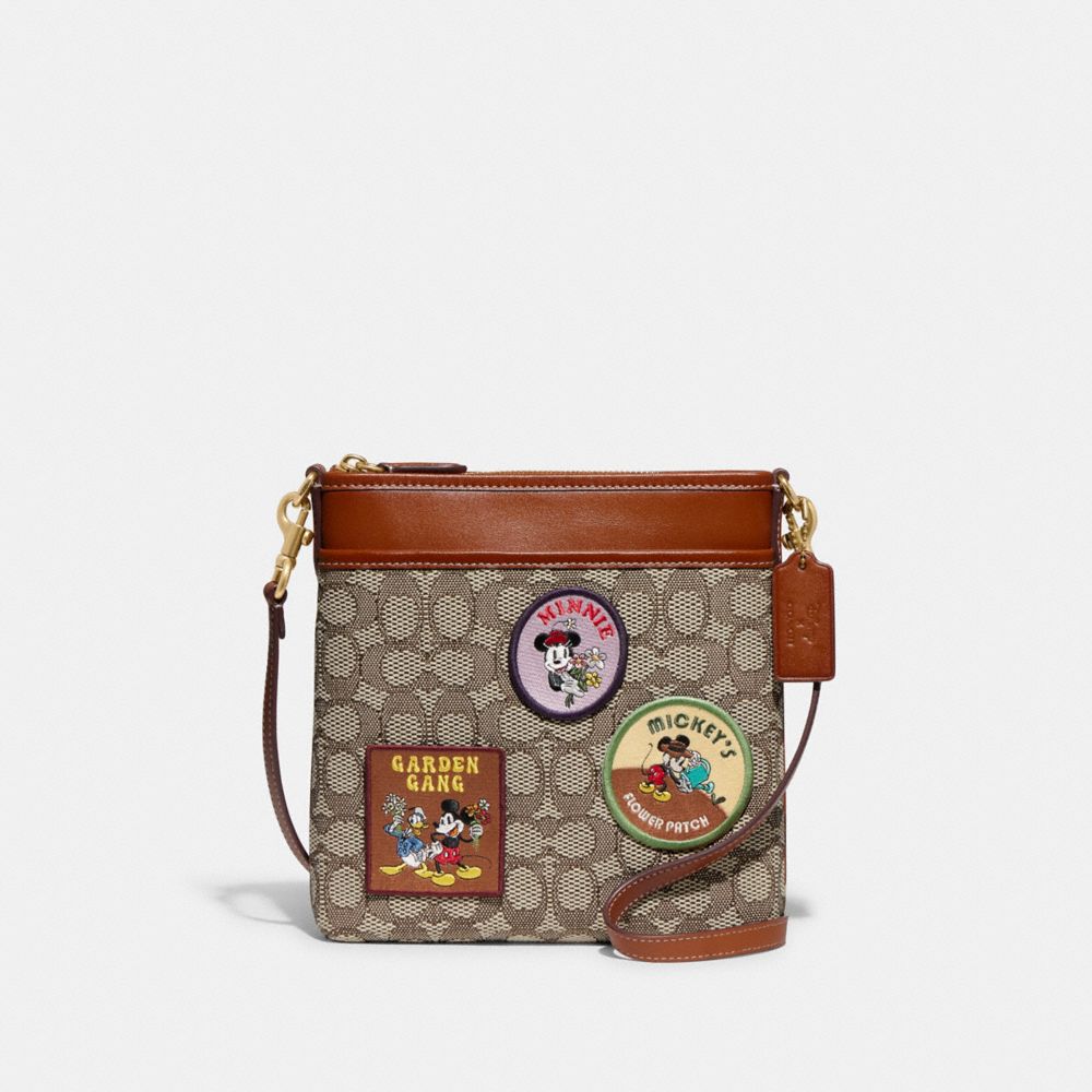 COACH®,DISNEY X COACH KITT MESSENGER CROSSBODY IN SIGNATURE TEXTILE JACQUARD WITH PATCHES,Jacquard,Medium,,Front View