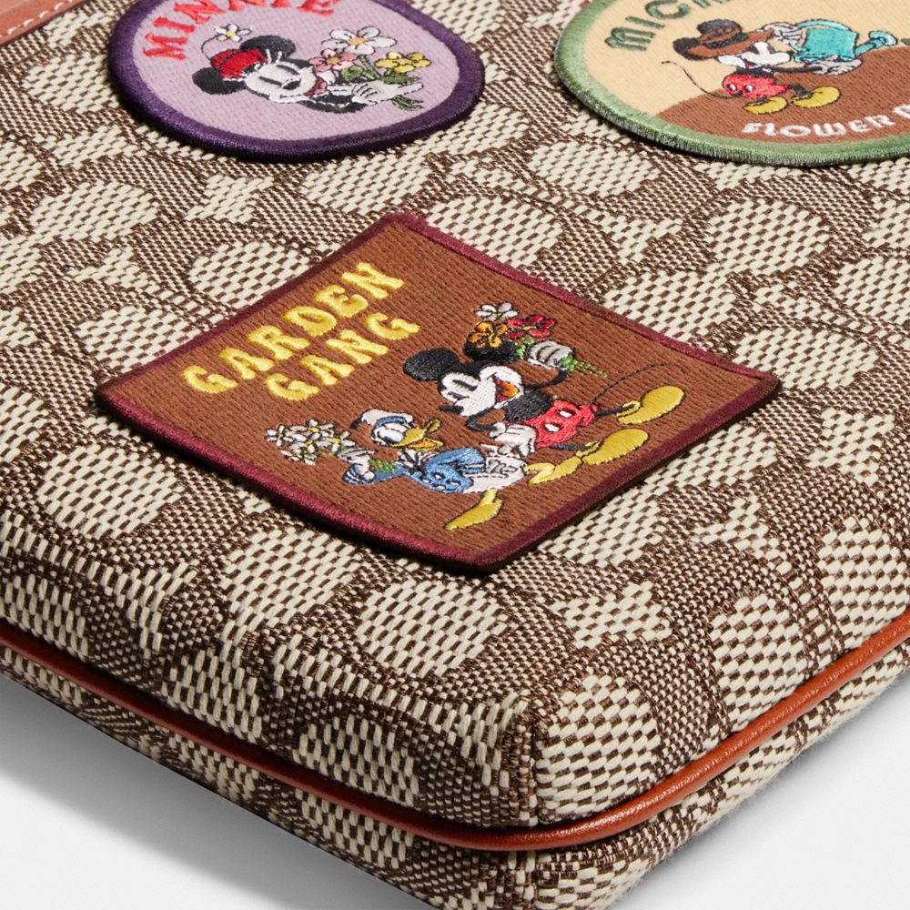 COACH®,DISNEY X COACH KITT MESSENGER CROSSBODY IN SIGNATURE TEXTILE JACQUARD WITH PATCHES,Jacquard,Medium,,Closer View