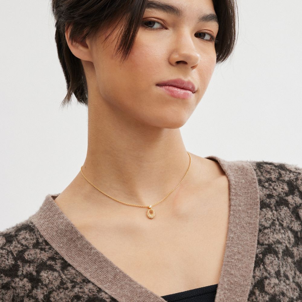 COACH®,Signature Pavé Necklace,Single Strand,Glass,Crystal,Gem Embellishment,Logo,Brass,Casual,Clear,Detail View