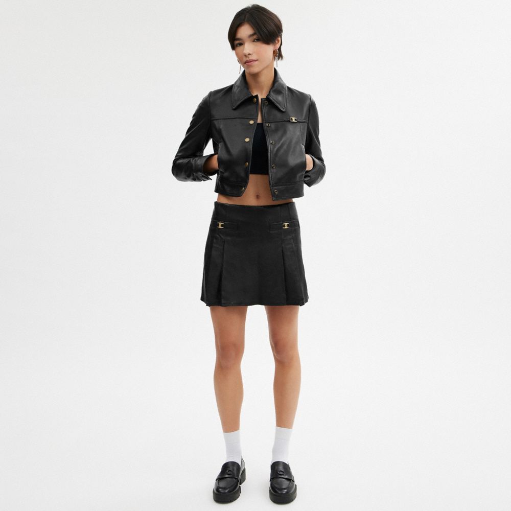 COACH®,Heritage C Leather Mini Skirt,Leather,Polyester,Pleated,A-Line,Logo,Metal,Pleats,Cocktail,Black,Scale View