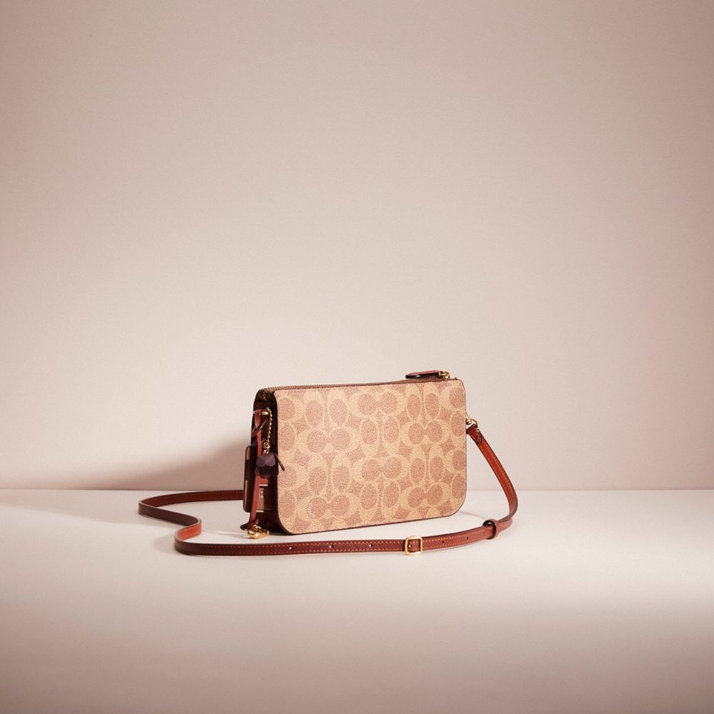 COACH®,UPCRAFTED NOA POP-UP MESSENGER IN SIGNATURE CANVAS,,Angle View