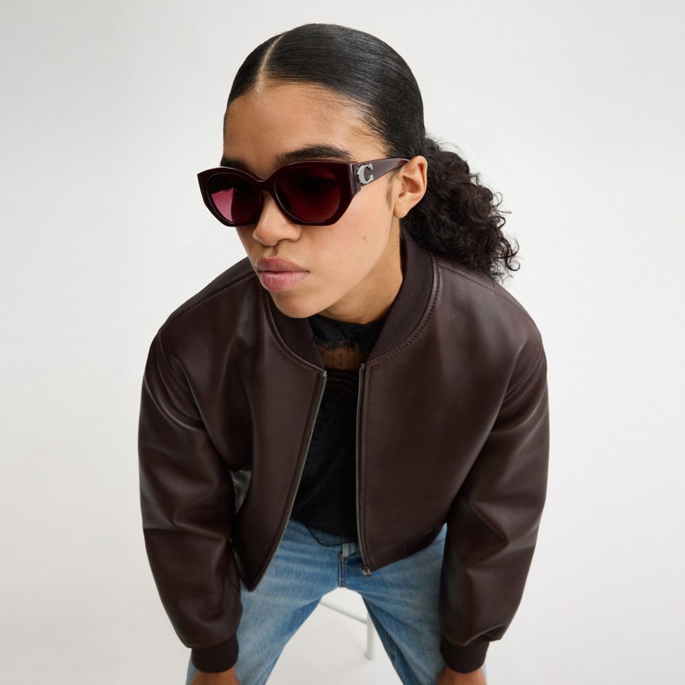COACH®,Maxi Sculpted C Oval Sunglasses,Cat Eye,Logo,Word Embellishment,Metal,Integrated Nose Pads,Casual,Maroon,Angle View