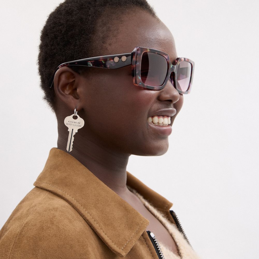 COACH®,Rivet Oversized Square Sunglasses,Square,Word Embellishment,Metal,Integrated Nose Pads,Casual,Purple,Angle View