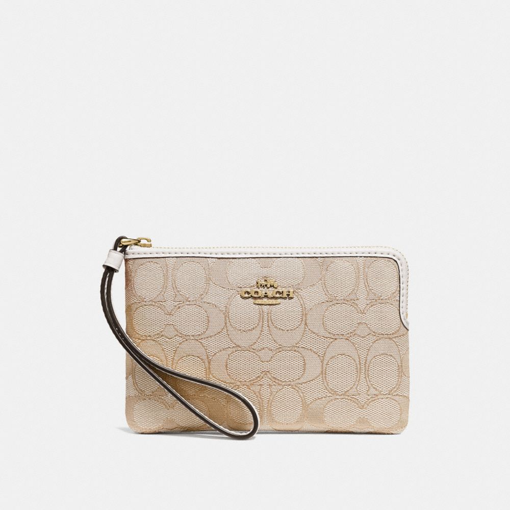 Coach CORNER ZIP WRISTLET IN SIGNATURE CANVAS