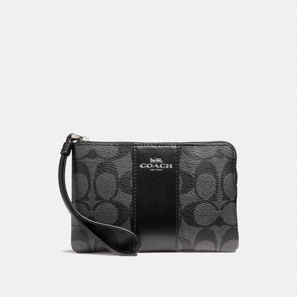 Coach CORNER ZIP WRISTLET IN SIGNATURE CANVAS