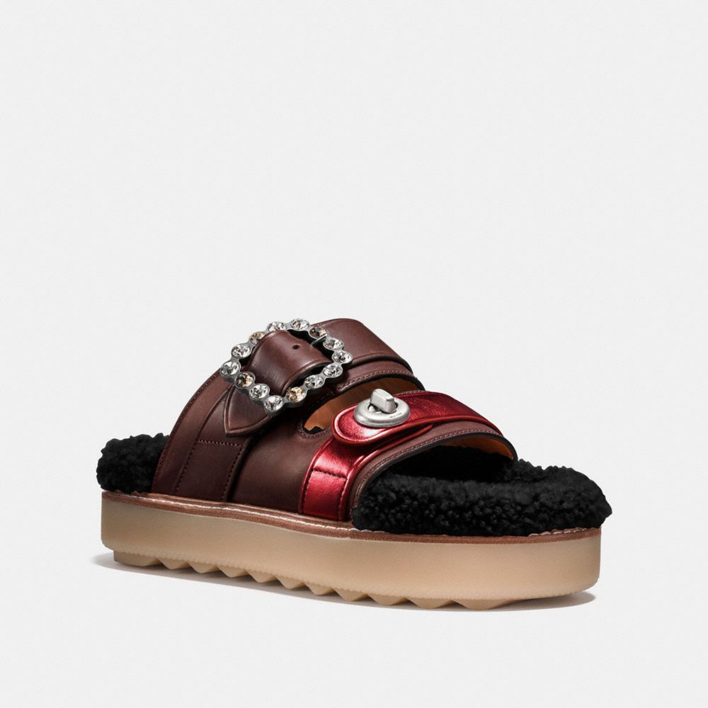 coach shearling slides