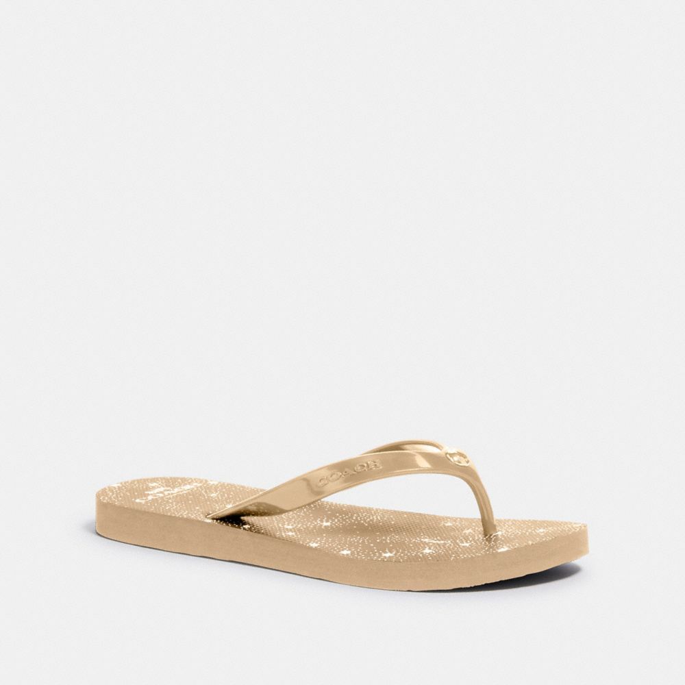 coach gold flip flops