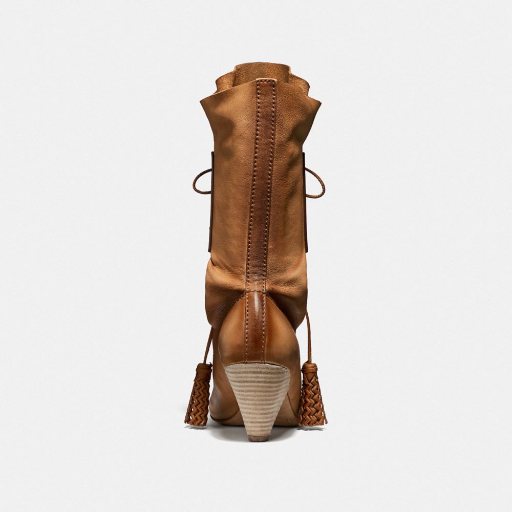 coach lace up tassle boot