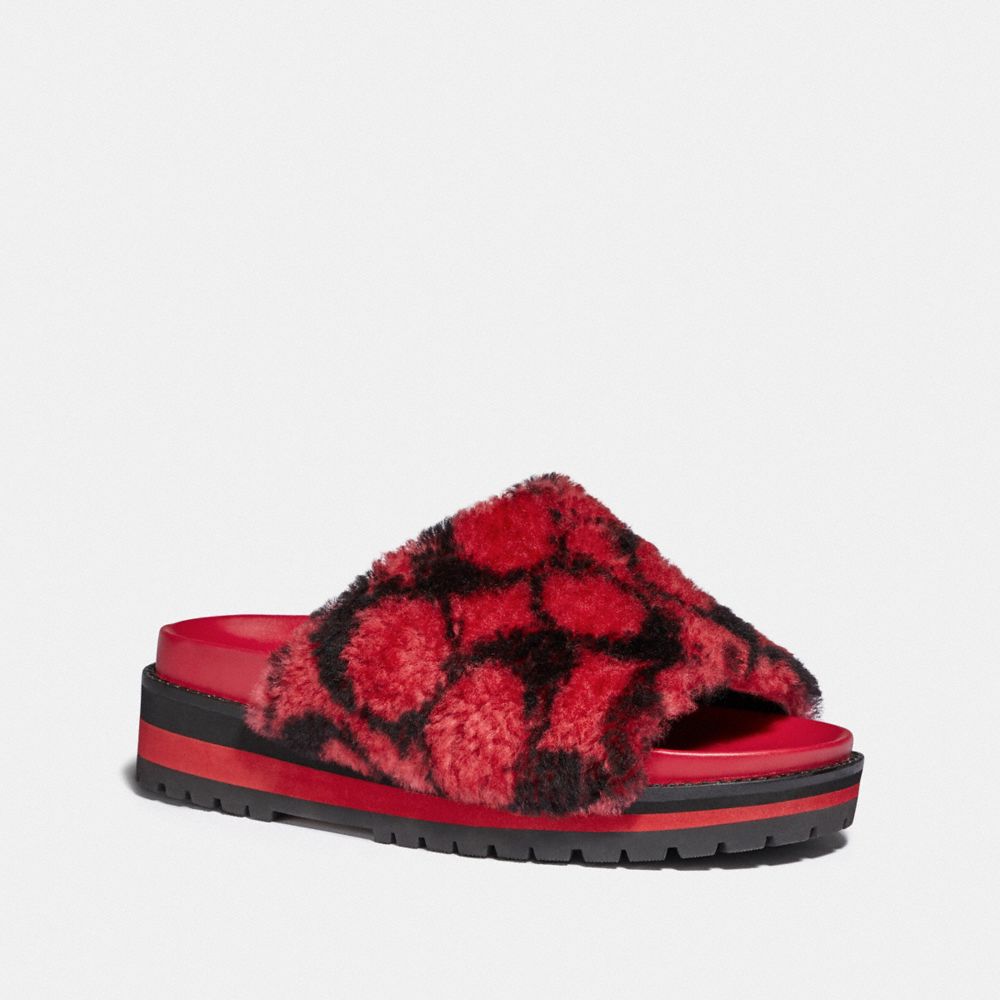 coach fur slides